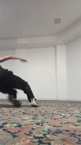Woman performs gymnastics routine in Porlamar resort room