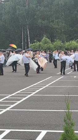 Youth group performs outdoor ceremony in rain in Belarus