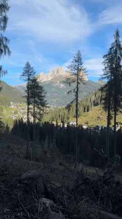 Morning trail walk above Canazei with Dolomite valley views