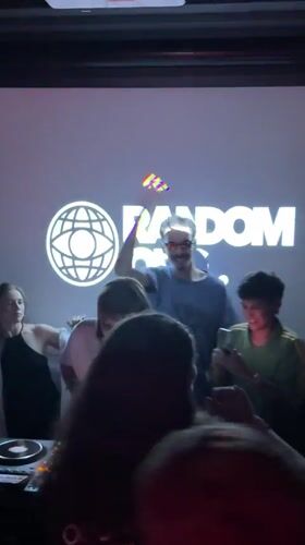 DJ performs for dancing crowd at Estosadok club