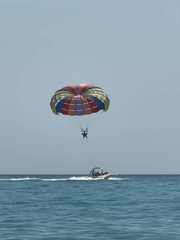 Colorful parasail ride over Adriatic waters in Boreti, Montenegro