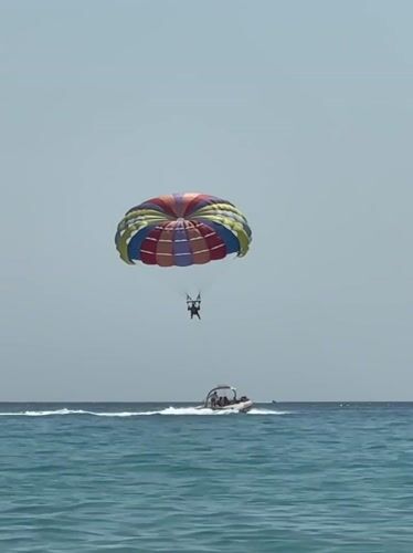 Colorful parasail ride over Adriatic waters in Boreti, Montenegro