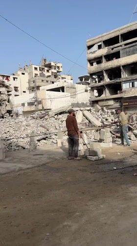 Dawn cleanup efforts documented amid widespread destruction in Gaza