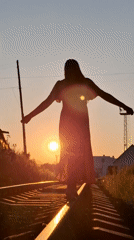Sunset silhouettes on railroad tracks in Chaikovsky, Russia
