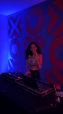 Backpackers socialize at São Paulo hostel during evening hours