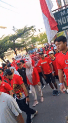 Red-and-white procession through the streets of Surakarta