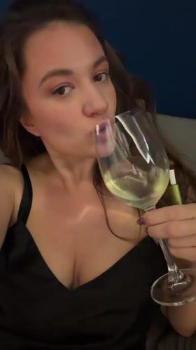 Woman enjoys white wine in relaxed Athens setting