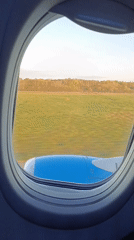 Passenger captures takeoff view from airplane window at Vnukovo