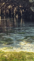 Floating and swimming a crystal-clear river in southern Italy