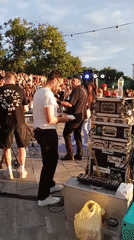 Waterfront cultural event with music, art and boats