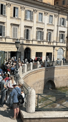 Tourists gather at Roman Forum, historic sites during sunny morning