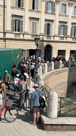 Tourists gather at Roman Forum, historic sites during sunny morning