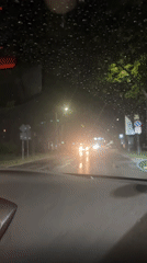 Driver navigates heavy rainstorm through Blagoevgrad streets at night