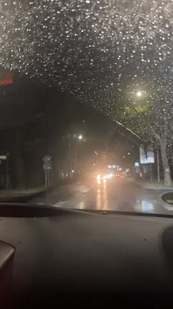 Driver navigates heavy rainstorm through Blagoevgrad streets at night