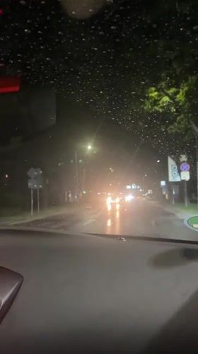 Driver navigates heavy rainstorm through Blagoevgrad streets at night