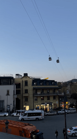 Evening scenes captured cable cars and outdoor art display in Tbilisi