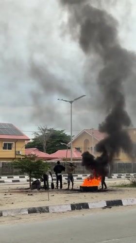 Vehicle fires and heavy equipment on a Lagos-area road