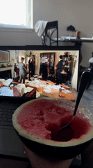 Watermelon snack and laptop streaming, late night in Fife