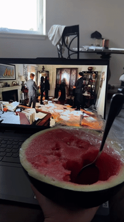 Watermelon snack and laptop streaming, late night in Fife