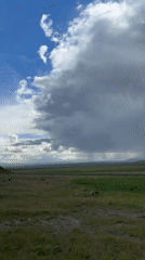 Storm clouds gather over Armenian countryside near Tlik