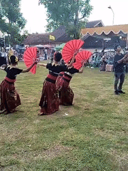 Young dancers perform traditional dances at outdoor cultural event