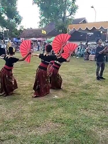 Young dancers perform traditional dances at outdoor cultural event