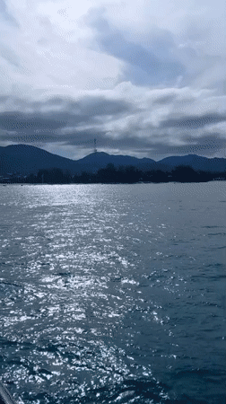 Ferry 'BANGKOK' docked at Ko Pha-ngan pier, passengers aboard