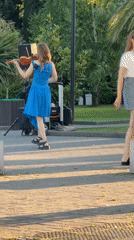 Street violinist performs in Sochi park during sunset hours
