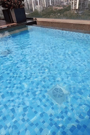 Early morning swimming lesson documented at Mumbai rooftop pool