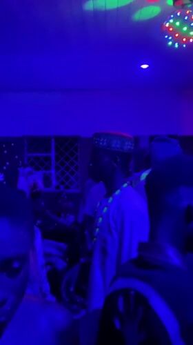 Indoor party with dancing captured in northern Nigeria villages