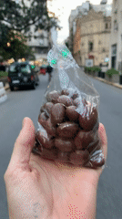 Person holds chocolate nuts bag on Buenos Aires street