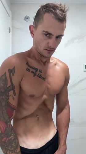 Morning bathroom routine in Finestrat, tattoos on display