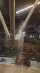 Star Alliance jet at Vnukovo gate on a rainy night