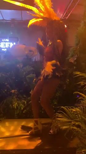 Feathered costume performers on a jungle-themed stage in Ko Samui