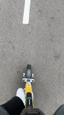 Electric scooter rider travels marked path in Estosadok, Russia