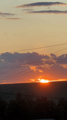 Outdoor festival with musical performances documented during sunset hours