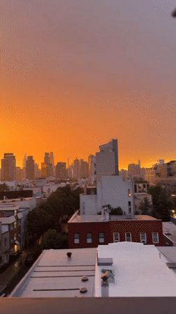 NYC skyline sunset fades from orange to purple in time-lapse