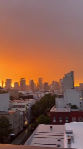NYC skyline sunset fades from orange to purple in time-lapse