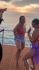Dancing on deck at sunset off Ko Samui