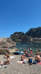 Sunny beach day draws crowds for swimming and boating