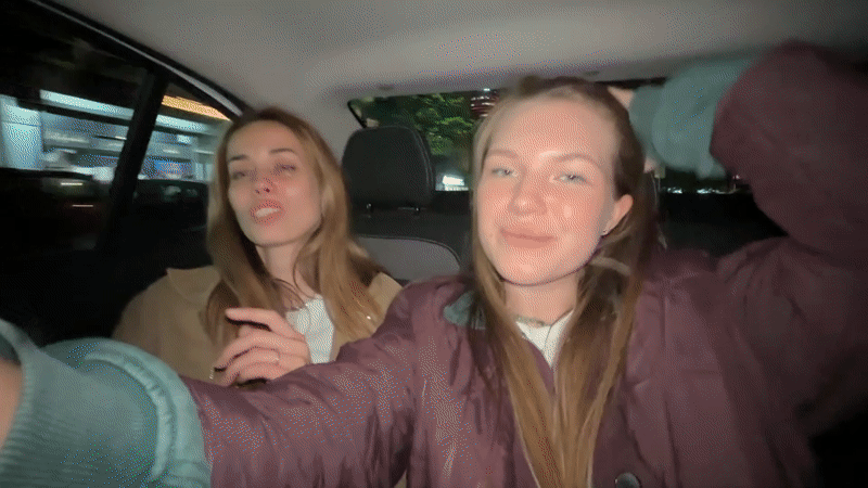 Two women film selfie video in car, Belgrade