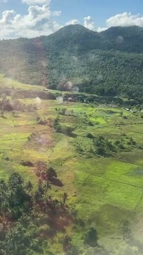 Aerial view captures rural Philippine landscape with rice paddies