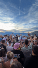 Clifftop gathering overlooks Špiljari at sunset