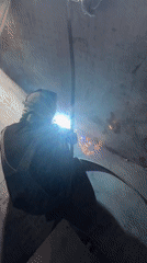 Welding work on a large cylindrical structure in Taganrog