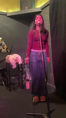 Live vocal performance on a Melbourne stage, July 2026