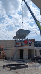 Crane sets hopper onto stone crusher at Armenian industrial site