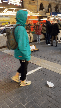 Street violinist performs near Buenos Aires theater showing Rocky musical