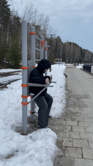 Person exercises on outdoor equipment in Chaykovsky, Russia