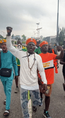 Young men march in Ikeja wearing "Bring Back Our Children" message