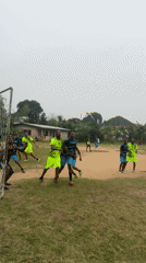 Soccer match played on dirt field in Ikot Ekpene